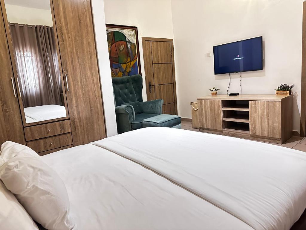 Ένα ή περισσότερα κρεβάτια σε δωμάτιο στο Ogidi studios