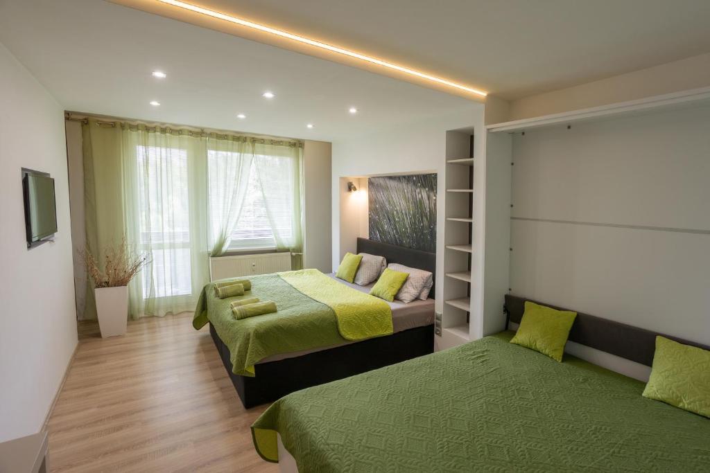 Ένα ή περισσότερα κρεβάτια σε δωμάτιο στο HARMONY Apartment