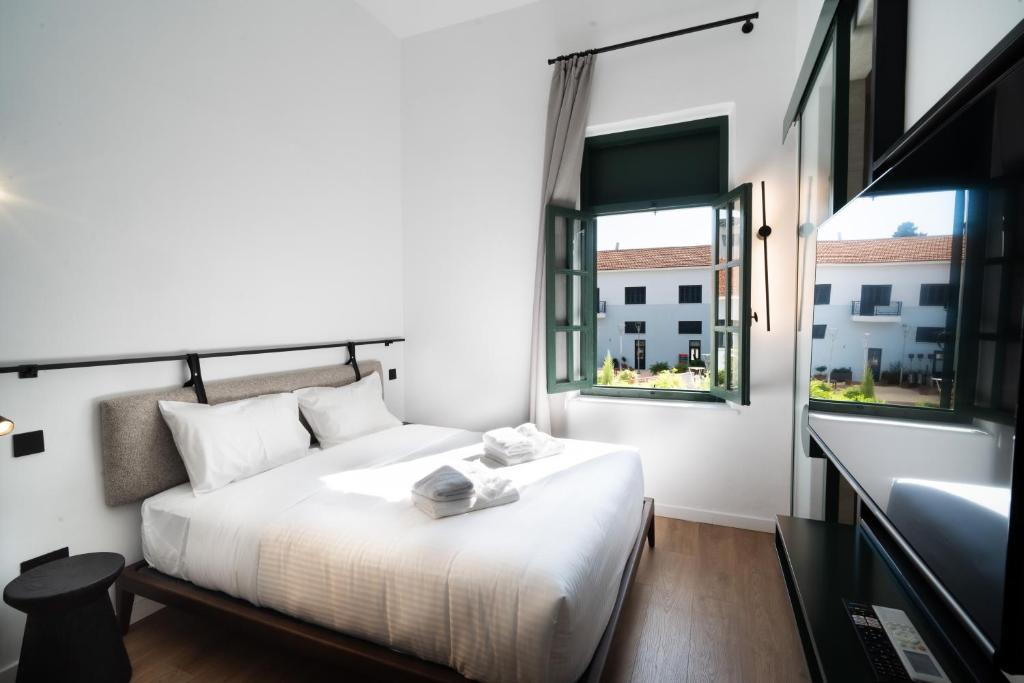 Ένα ή περισσότερα κρεβάτια σε δωμάτιο στο Kentrikon 1924 Boutique Hotel, Old Town