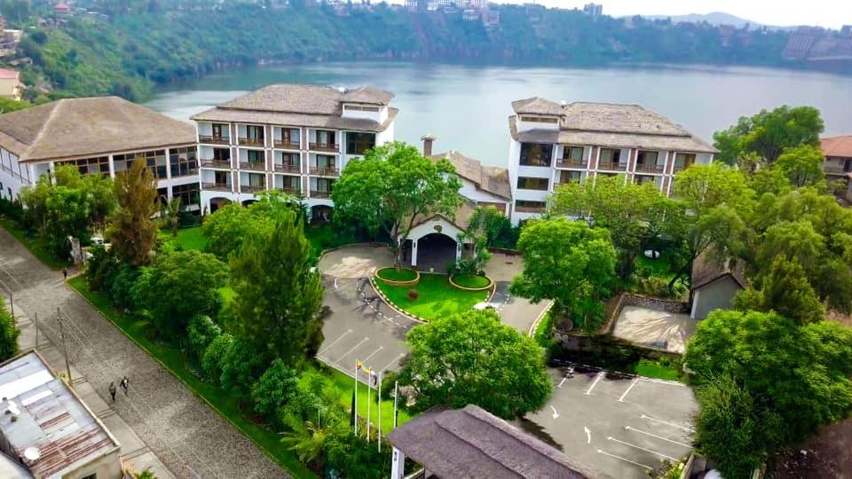 an aerial view of a resort with a lake at Noora Resort 