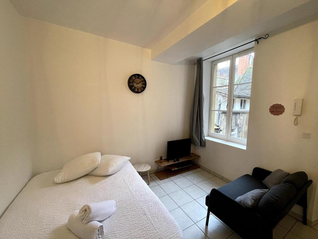 Postel nebo postele na pokoji v ubytování Le Théâtre 3