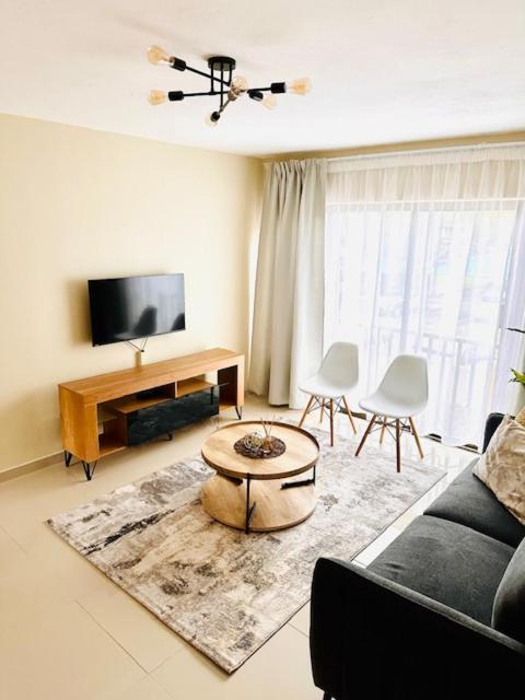 Un televizor și/sau centru de divertisment la 12th on The Bay