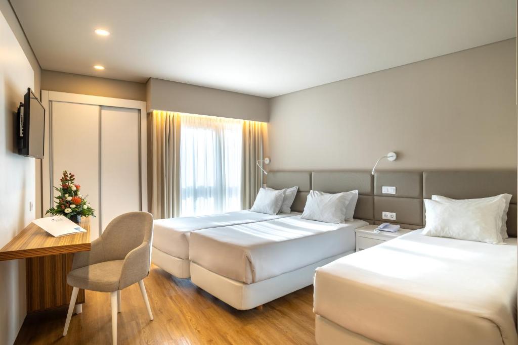 Ένα ή περισσότερα κρεβάτια σε δωμάτιο στο Hotel Cristal Caldas