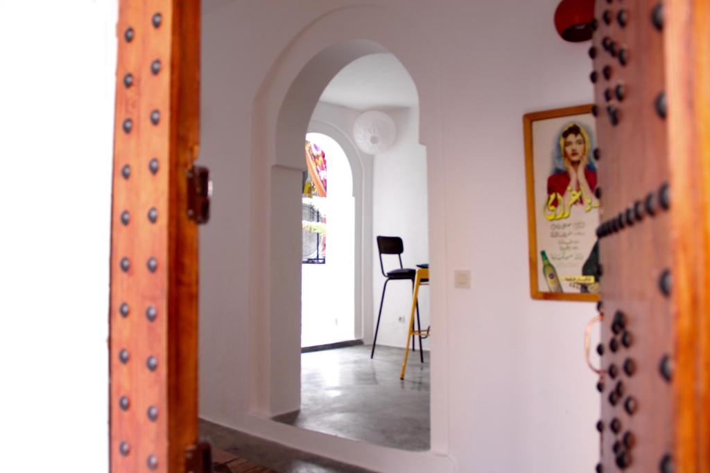 a hallway with an archway in a house at Dar Jiblia in Chefchaouene