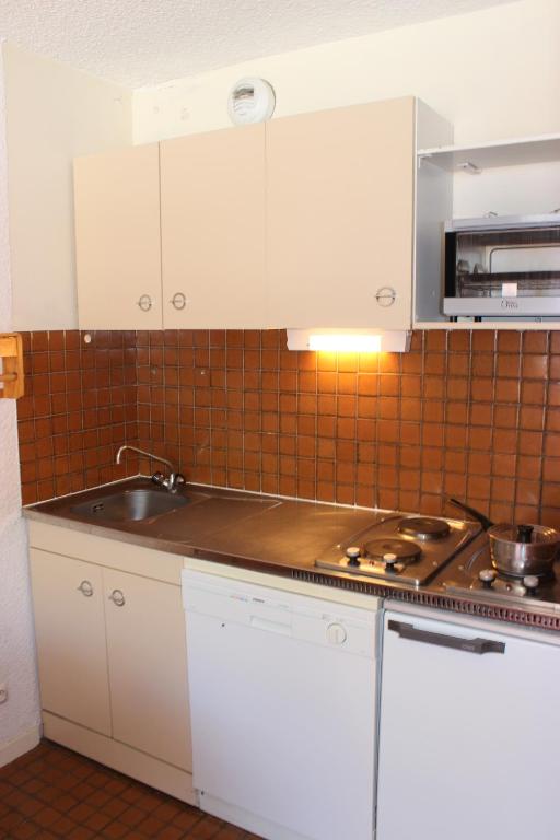 Kuchyň nebo kuchyňský kout v ubytování Trois Vallées Appartements VTI