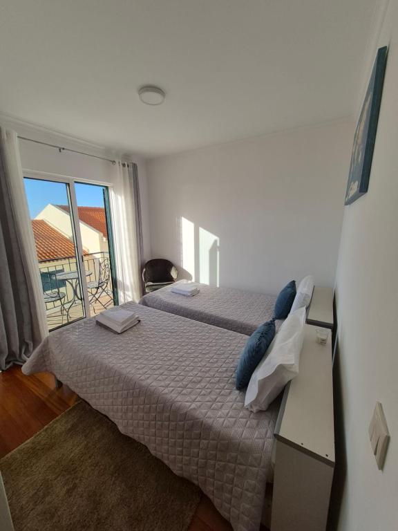 Ένα ή περισσότερα κρεβάτια σε δωμάτιο στο LandS