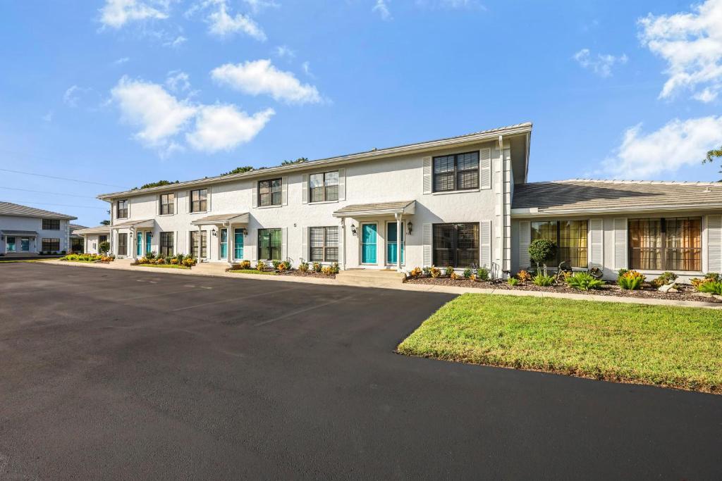 a large white house with a driveway at San Marco Villas S-7 in Marco Island