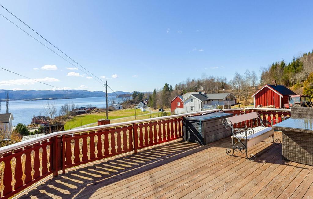 a large deck with a view of the water at 2 Bedroom Stunning Home In Bjugn in Moen