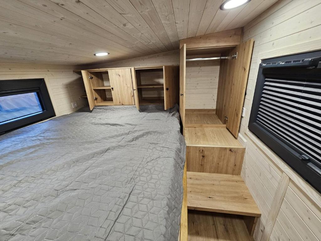 Ένα ή περισσότερα κρεβάτια σε δωμάτιο στο Tiny House Ingo John 'Vanessa'