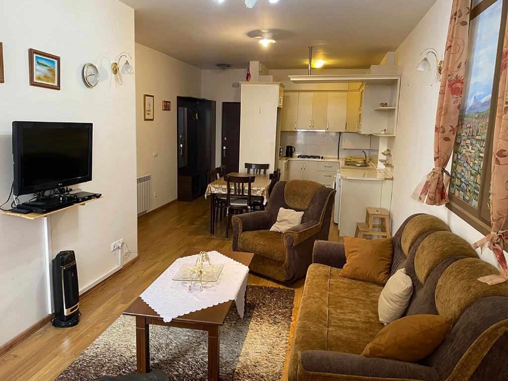 a living room with a couch and a table at family house in Aghk'ilisa