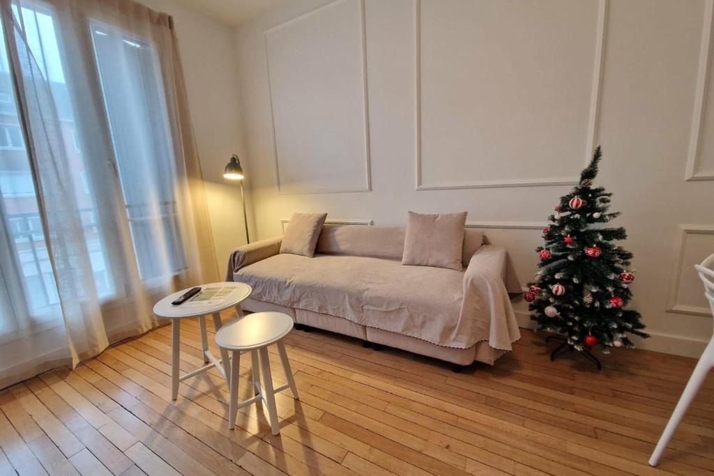 Ένα ή περισσότερα κρεβάτια σε δωμάτιο στο Apart'Champagne Les Deux Ponts station & center