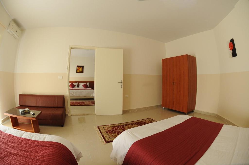 Postel nebo postele na pokoji v ubytování Byblos Guest House