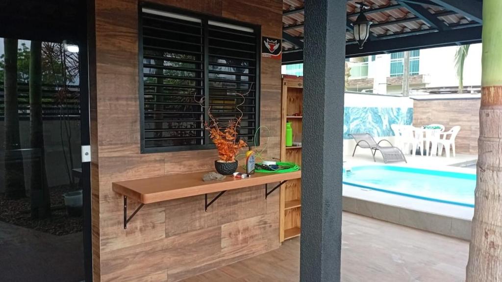 Πισίνα στο ή κοντά στο Cantinho das Palmeiras em Itapoá- Casa c piscina p 6 pessoas