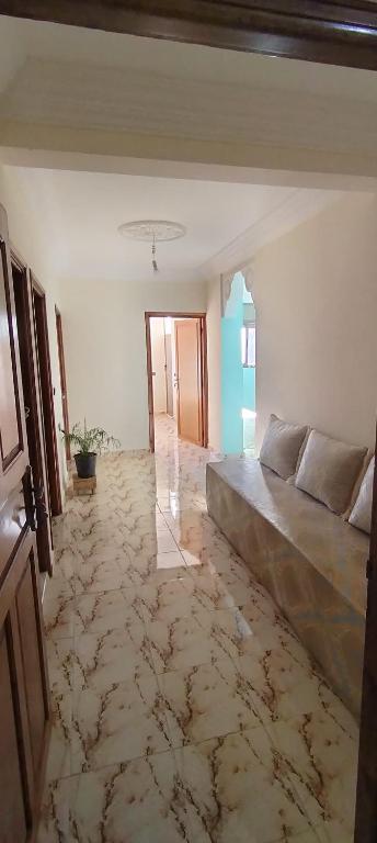 a bedroom with a large bed in a room at Dar Fatima in Aït Ali