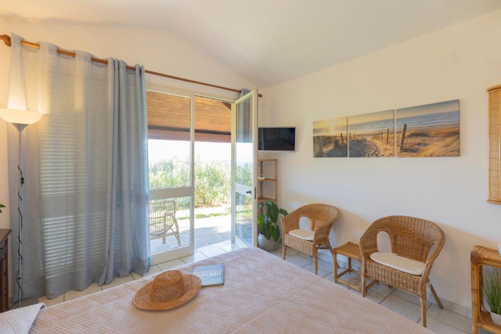 Postel nebo postele na pokoji v ubytování Villetta Azzurra by ElbaSummer