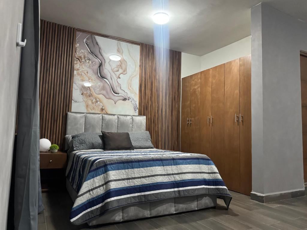 Ένα ή περισσότερα κρεβάτια σε δωμάτιο στο Departamentos de lujo con excelente ubicación