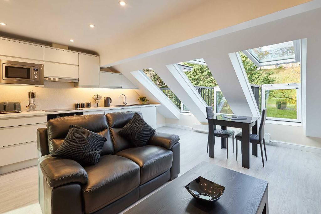 a living room with a couch and a table at Host & Stay - Ross's View in Whitby