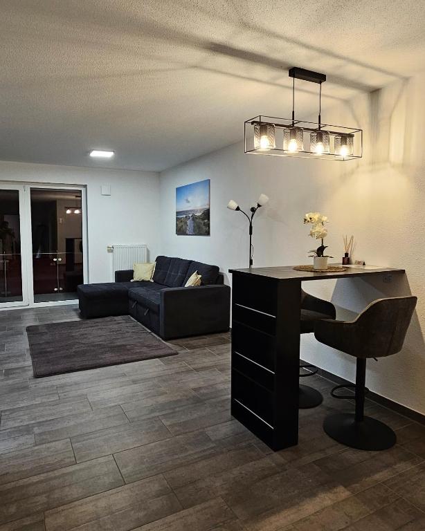 a living room with a table and a couch at MY HOME 23 Nr 8 in Villingen-Schwenningen