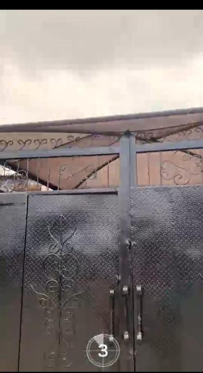 a glass table with a reflection of a plant on it at APARTMENT for RENT in Baruwa