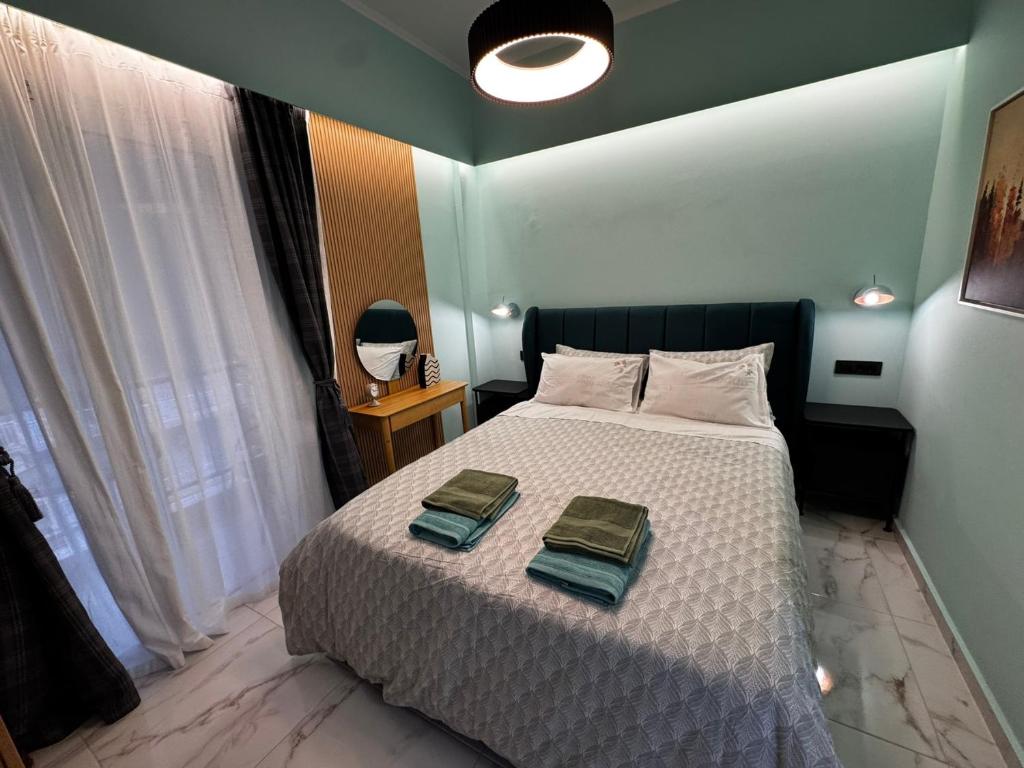 Ένα ή περισσότερα κρεβάτια σε δωμάτιο στο Luxury Living Patras