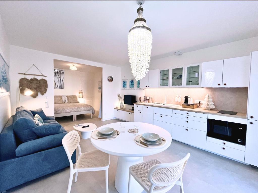 O bucătărie sau chicinetă la Douc Evasion - Appartement climatisé proche Montpellier, Parc Expo et Aéroport, avec parking sécurisé et accès rapide aux plages