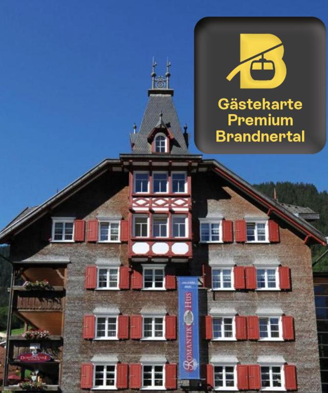 a building with a sign on top of it at Romantikhus in Brand