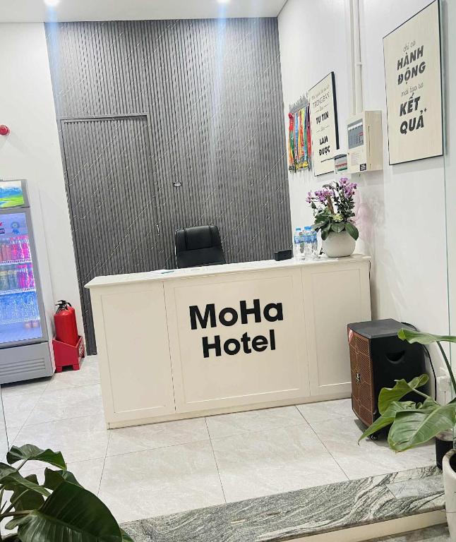 a mola hotel sign on a counter in a store at MoHa Hotel in Hanoi