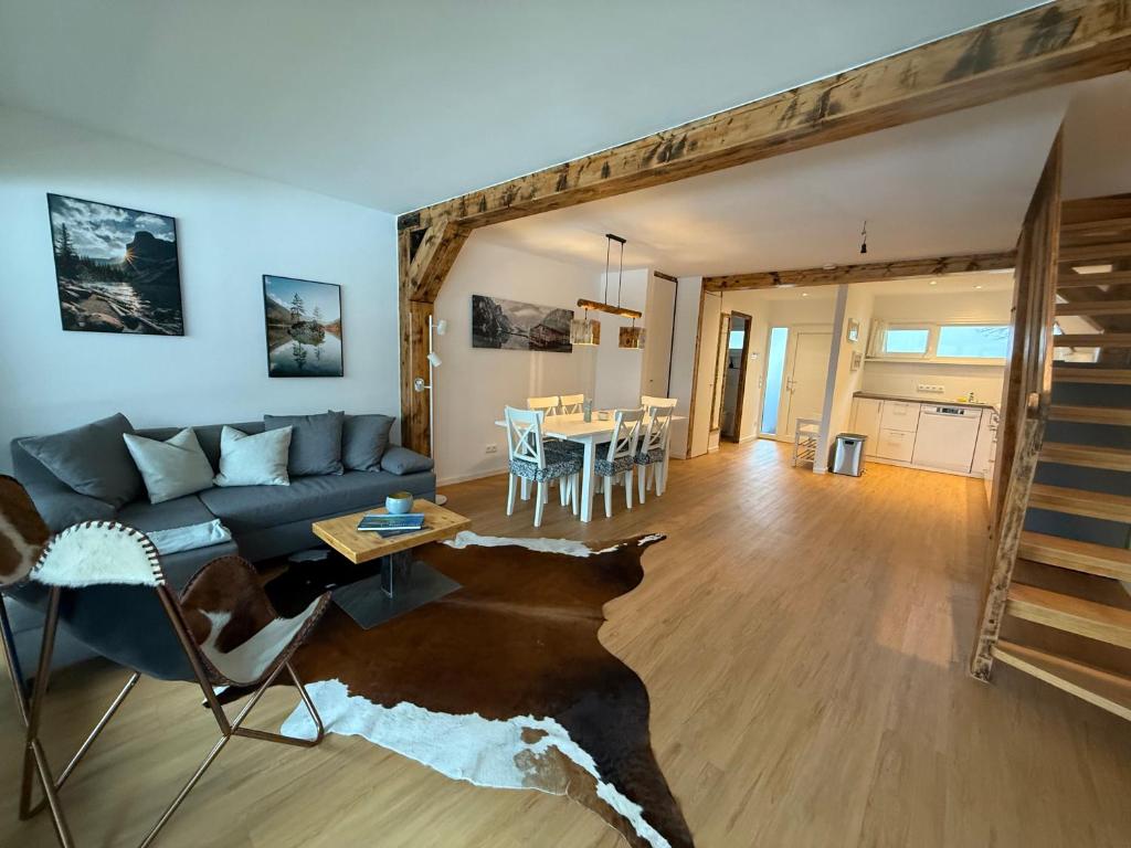a living room with a couch and a table at Ferienwohnung Leni in Siegsdorf
