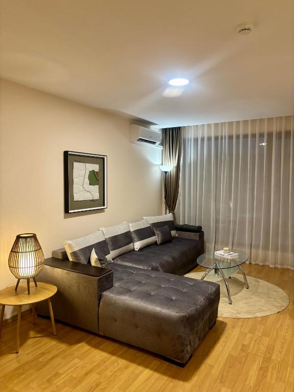 a living room with a couch and a table at Luxury in Sveti Vlas