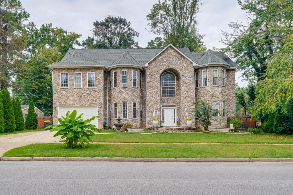 a large brick house with a driveway at Stay Near DC! Group Getaway with Easy Metro Access in Springfield