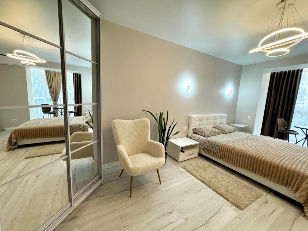 Ένα ή περισσότερα κρεβάτια σε δωμάτιο στο Apart Dolce Vita ЖК Great House