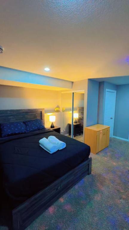 a bedroom with a bed with two pillows on it at DM Stays in Brandon