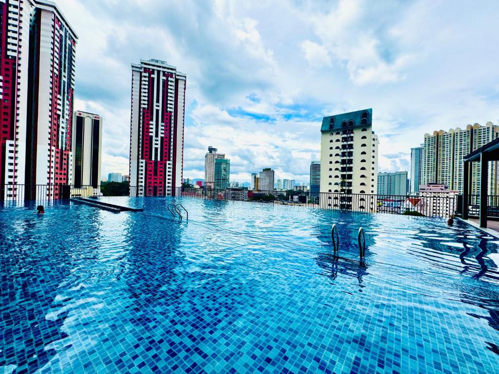 a swimming pool on the roof of a building at Chamber Suites KL At Sky World in Kuala Lumpur