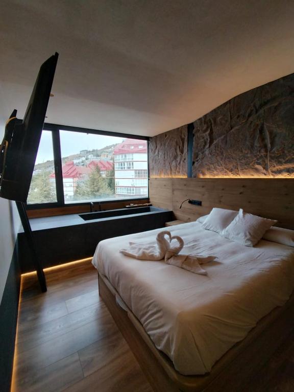 En eller flere senge i et værelse på Slalom luxury con vistas