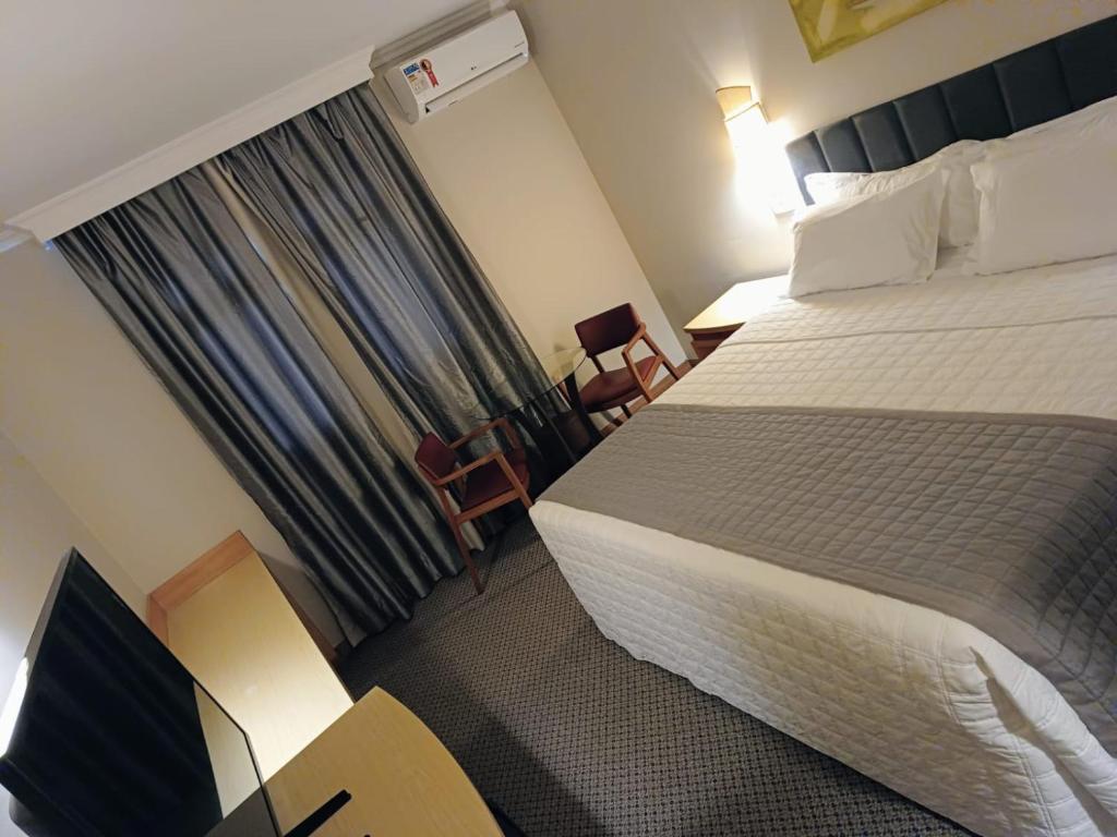 Postel nebo postele na pokoji v ubytování Hotel Exclusivo