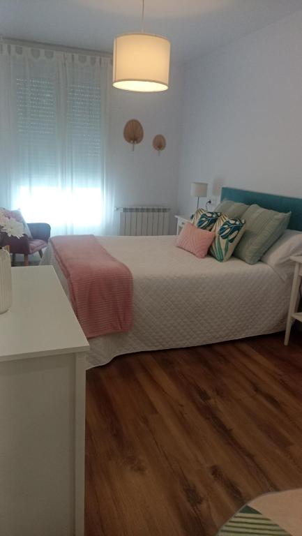 a bedroom with a large bed in a room at Bruma in Vilagarcia de Arousa