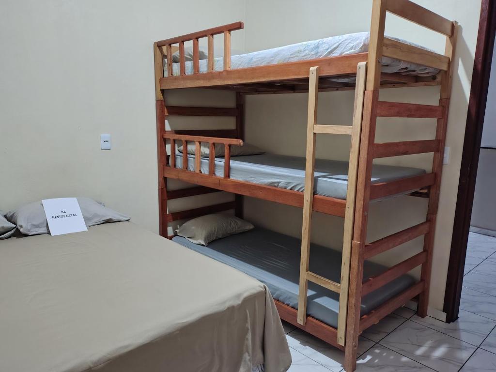 a bunk bed and a bunk room with a bunk bed at KL Residencial in Manaus