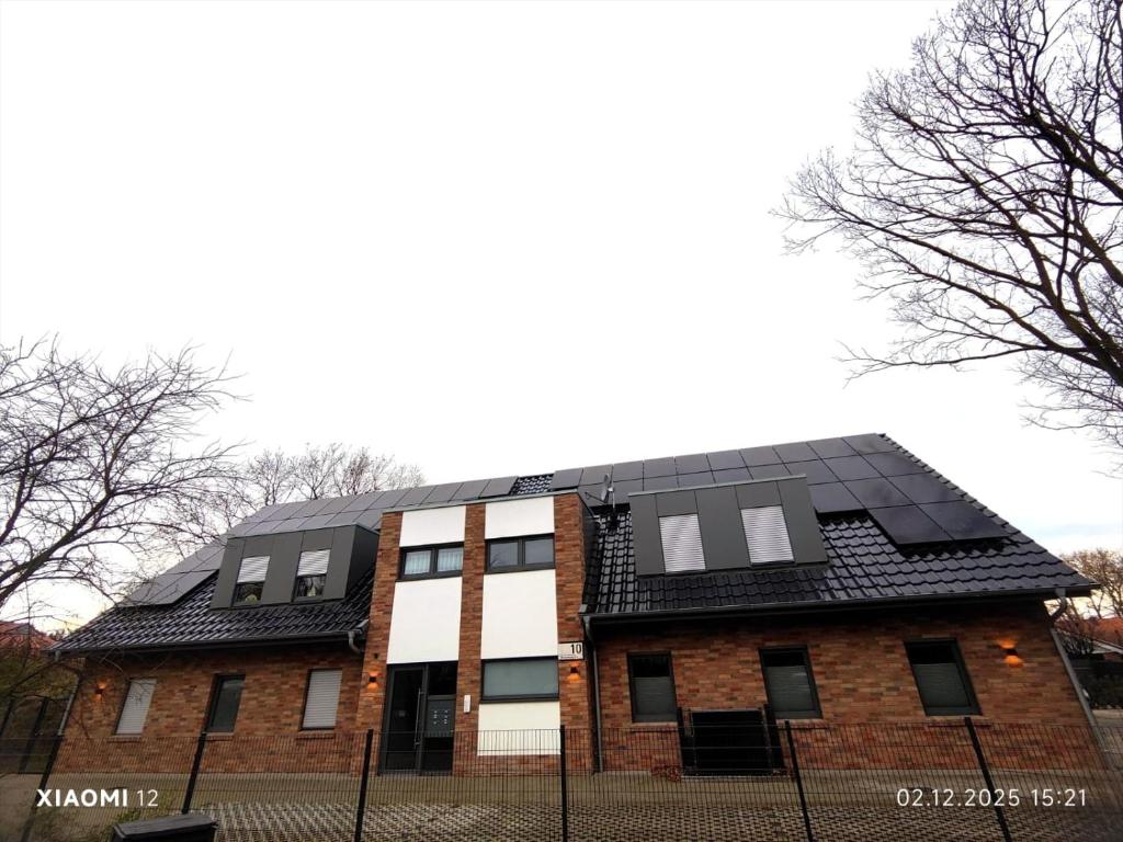 a house with solar panels on top of it at Fe-Wo Varenrode in Spelle