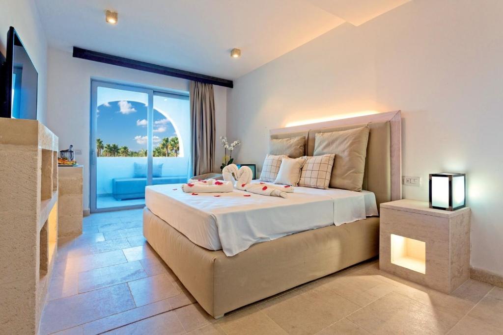 Ένα ή περισσότερα κρεβάτια σε δωμάτιο στο HOTEL BARONE DI MARE