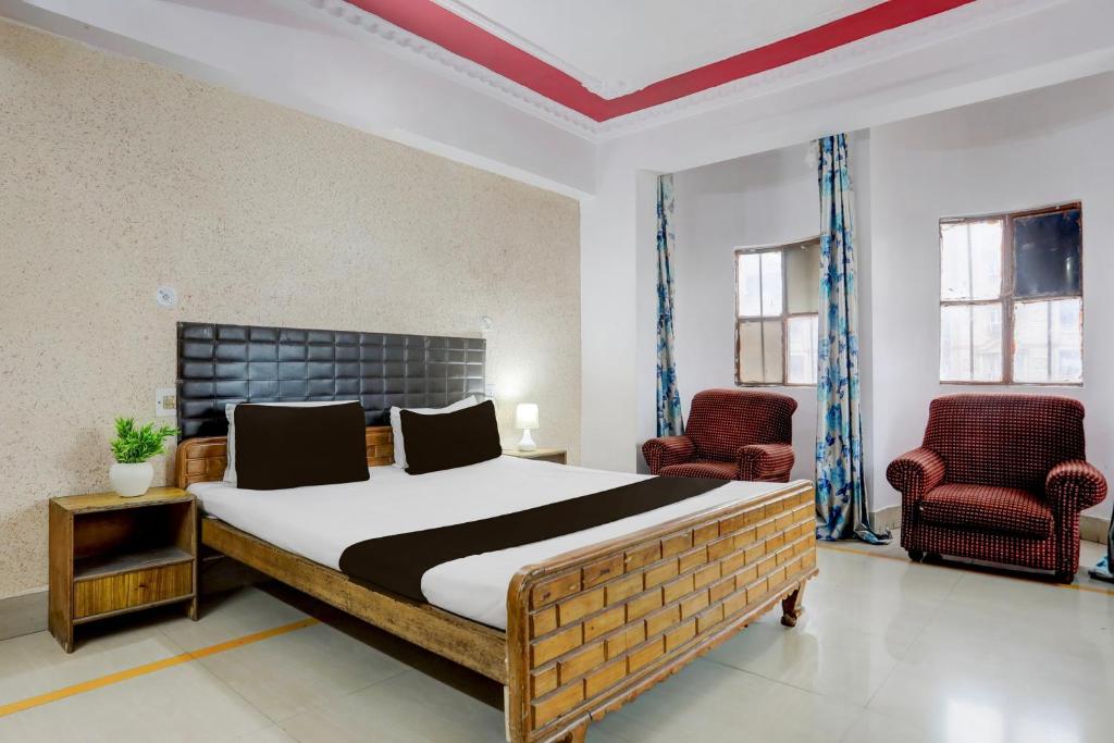 Ένα ή περισσότερα κρεβάτια σε δωμάτιο στο Hotel O Welcome Palace