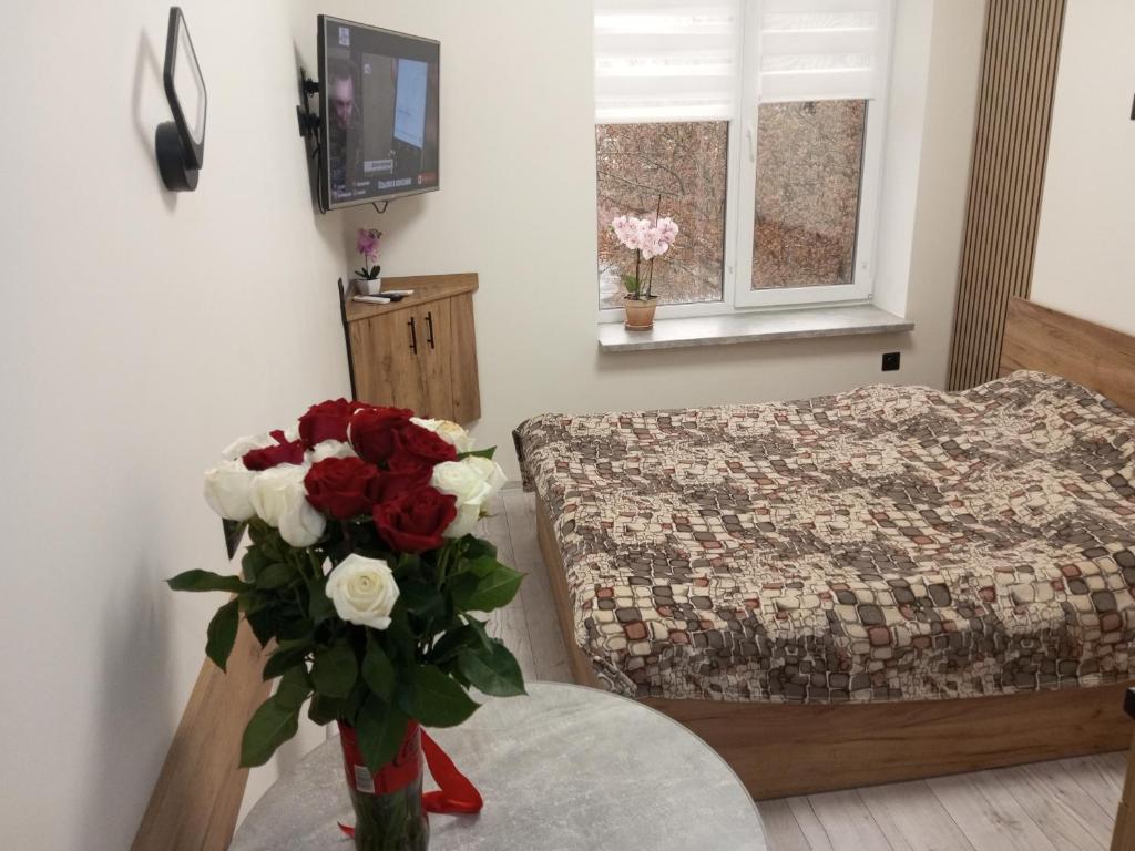 Ένα ή περισσότερα κρεβάτια σε δωμάτιο στο Апартаменти