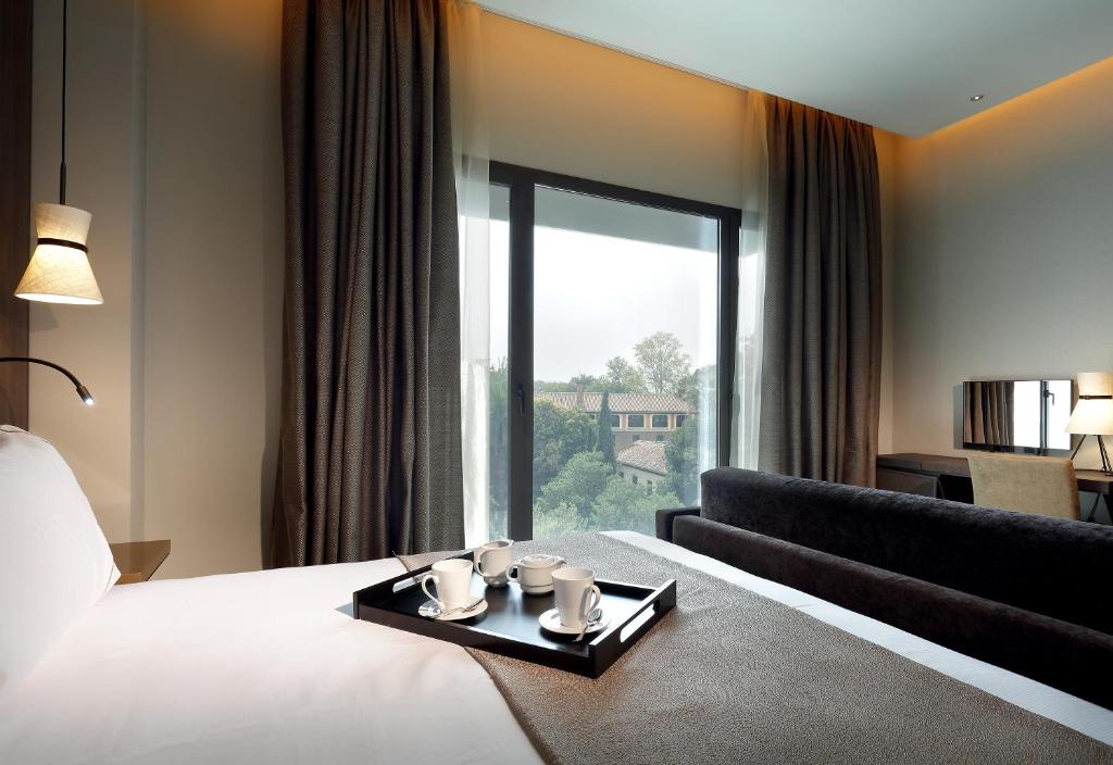Posteľ alebo postele v izbe v ubytovaní Áurea Washington Irving by Eurostars Hotel Company