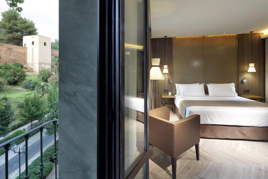 Posteľ alebo postele v izbe v ubytovaní Áurea Washington Irving by Eurostars Hotel Company