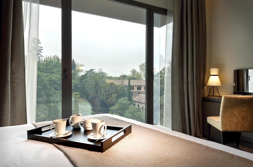 Posteľ alebo postele v izbe v ubytovaní Áurea Washington Irving by Eurostars Hotel Company