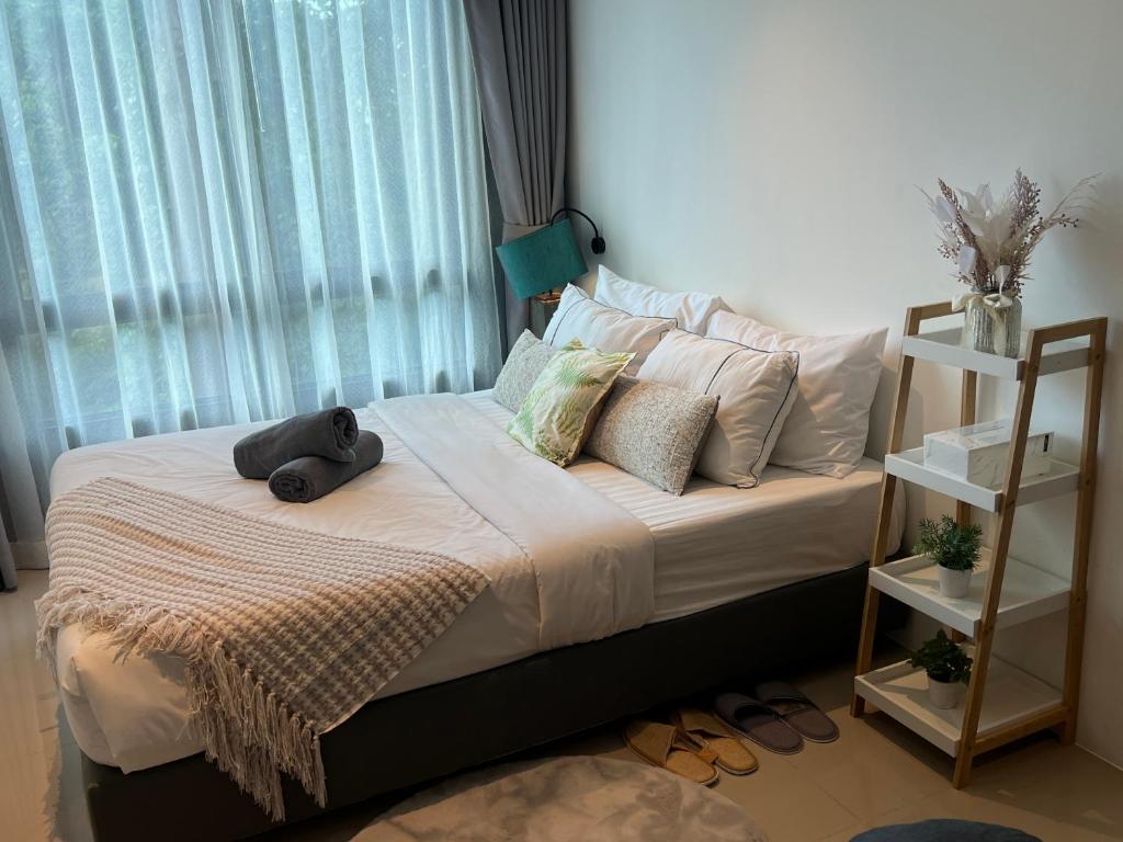 Ένα ή περισσότερα κρεβάτια σε δωμάτιο στο Utopia Central