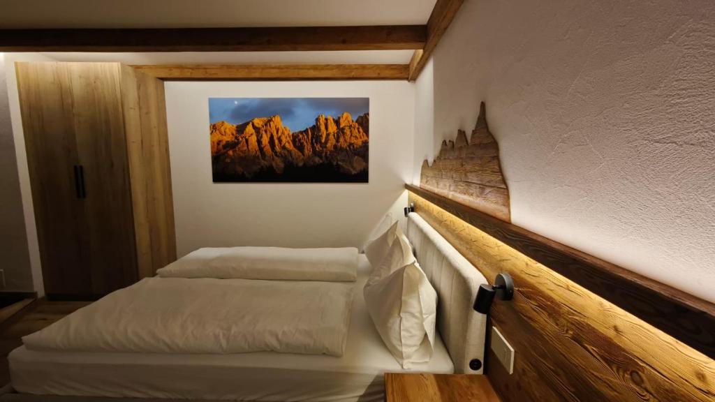 En eller flere senge i et værelse på Il Laricino