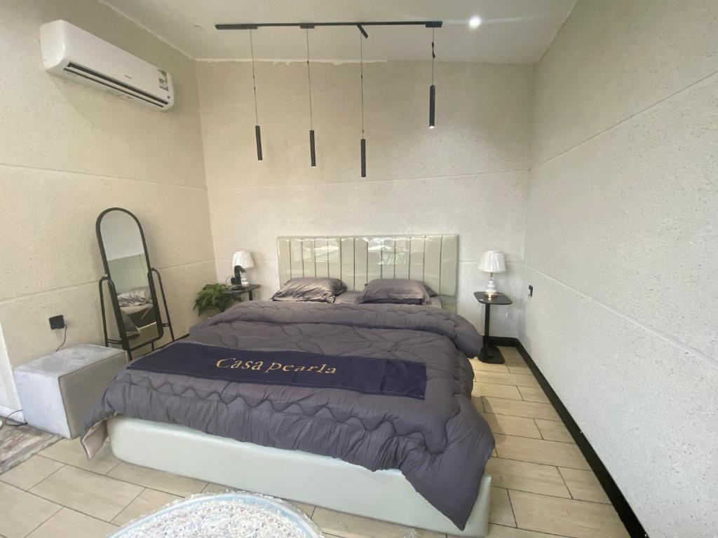 En eller flere senge i et værelse på شاليه كاسا بيرلا - Casa Pearla