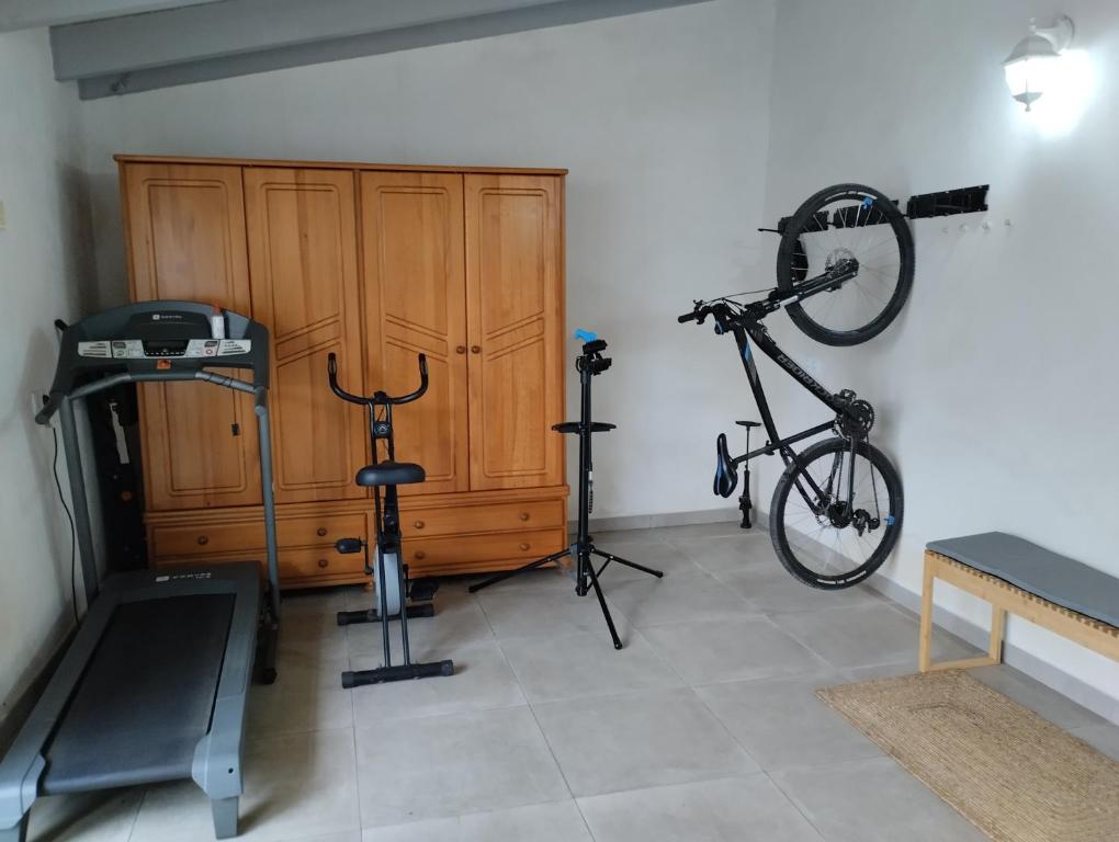 a room with a gym with a bike on the wall at Villa Yasmin Blue in Muro
