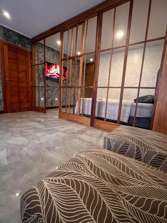 A television and/or entertainment centre at Edificio Suites los Laureles
