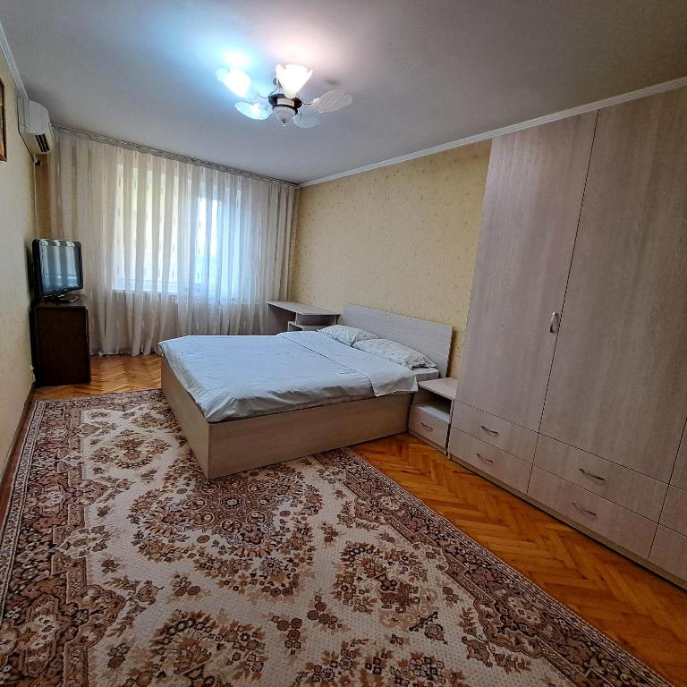 Llit o llits en una habitació de Центр